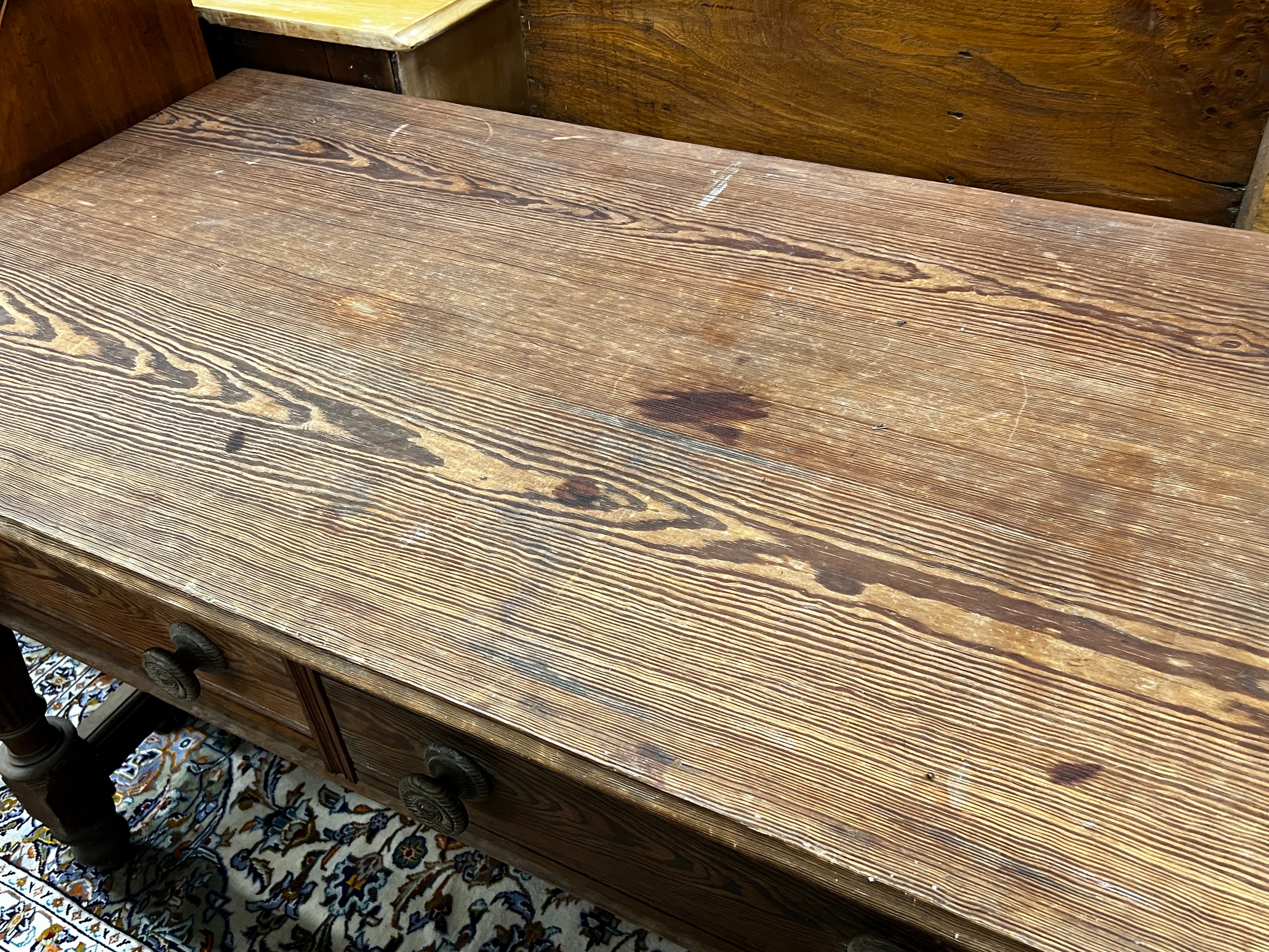 A Victorian stained pitch pine two drawer serving table by repute from Balmoral Castle kitchens, length 136cm, width 76cm, height 84cm